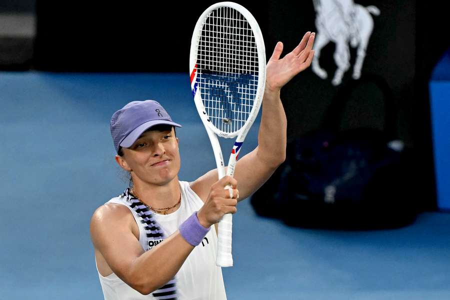 Iga Swiatek celebrates victory over Maddison Inglis