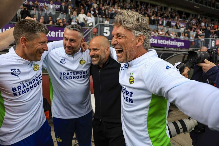 Peter Bosz (2-R) and his staff celebrate winning the Eredivisie title Peter Bosz (2-R) and his staff celebrate winning the Eredivisie title