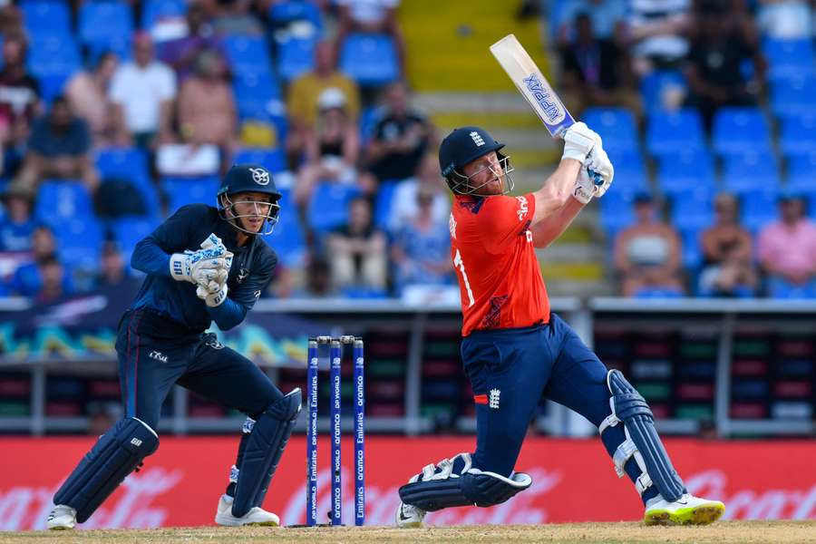England's Jonny Bairstow hits while Namibia's Zane Green (L) watches