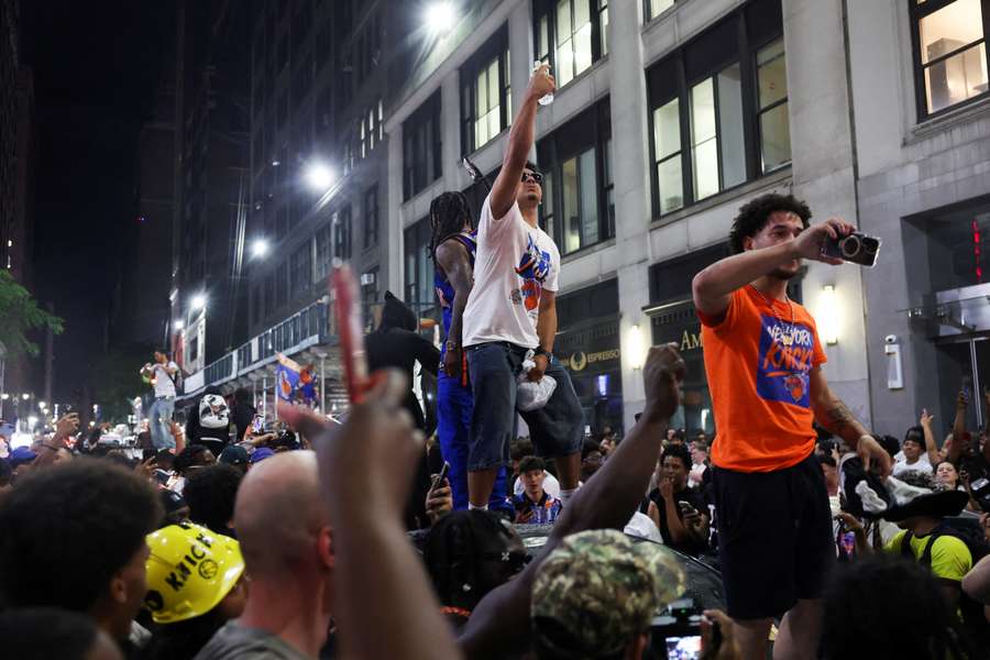 Fans celebrate after the New York Knicks beat the San Antonio Spurs in the Game 4 of the NBA Finals