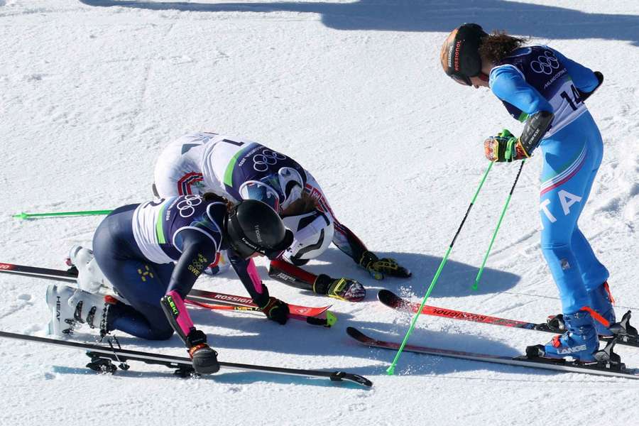 Thea Louise Stjernesund of Norway and Sara Hector of Sweden bow in front of Federica Brignone of Italy 