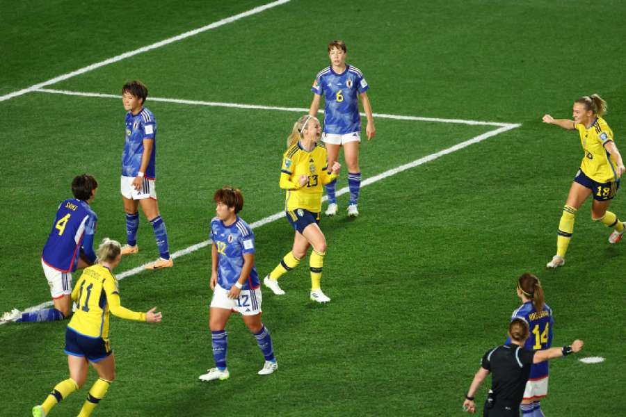 Sweden celebrate their opening goal against Japan