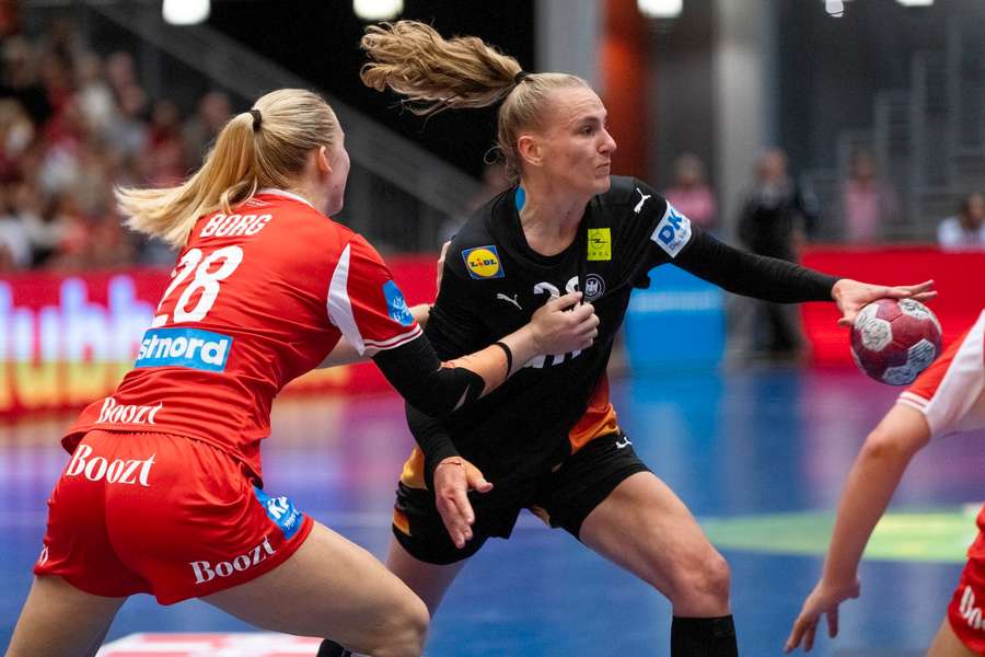 Germany's Annika Lott in action against Denmark's Laura Borg during the women's Golden League clash