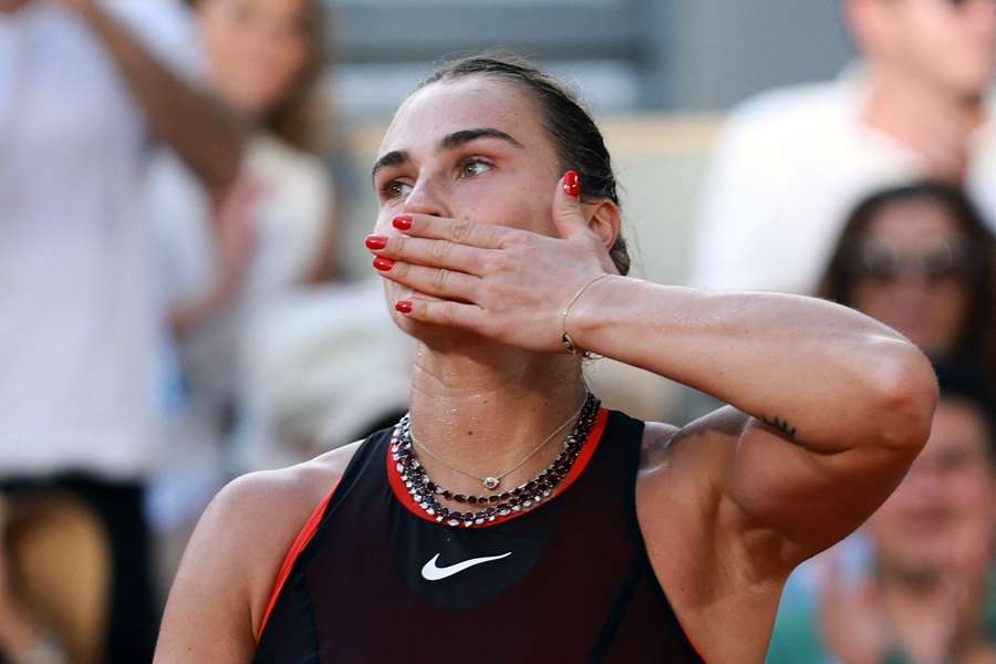 Aryna Sabalenka celebrates winning her second round match against Elsa Jacquemot