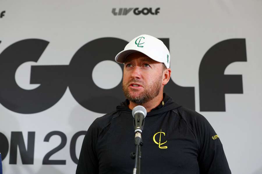 Graeme McDowell talks to the media during a practice round