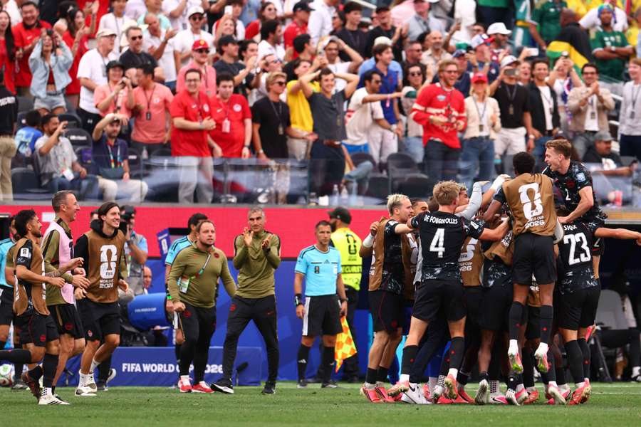 Canada celebrate their late winner
