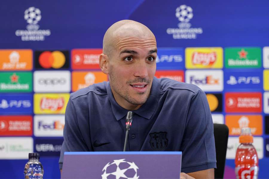 Barcelona's Spanish midfielder #18 Oriol Romeu gives a press conference