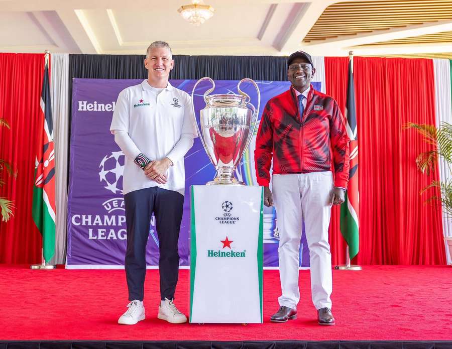 Schweinsteiger (left) posing with the UEFA Champions League trophy Schweinsteiger (left) posing with the UEFA Champions League trophy