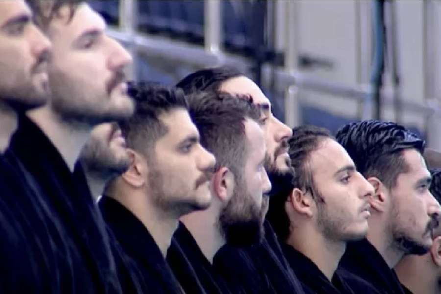 The Iranian men's water polo team not singing the national anthem at the Asian Championships