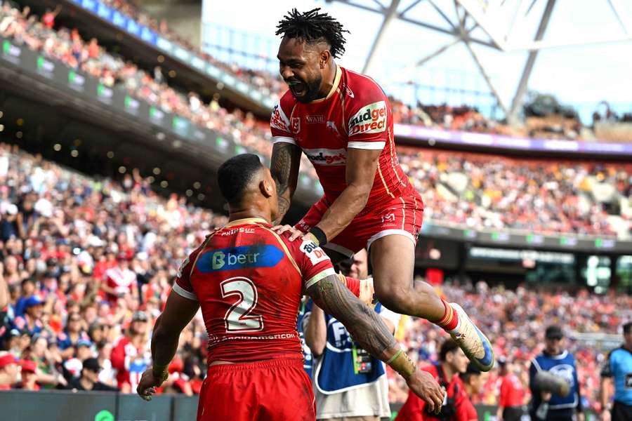 Jamayne Isaako and Hamiso Tabuai-Fidow celebrate a try scored at the weekend.