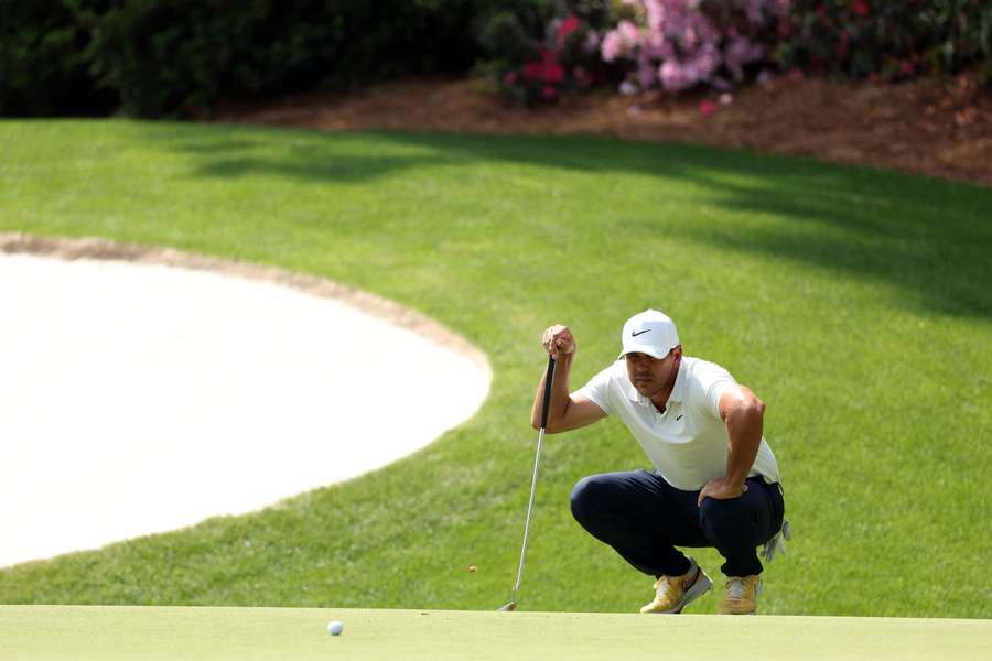 Brooks Koepka of the United States lines up a putt