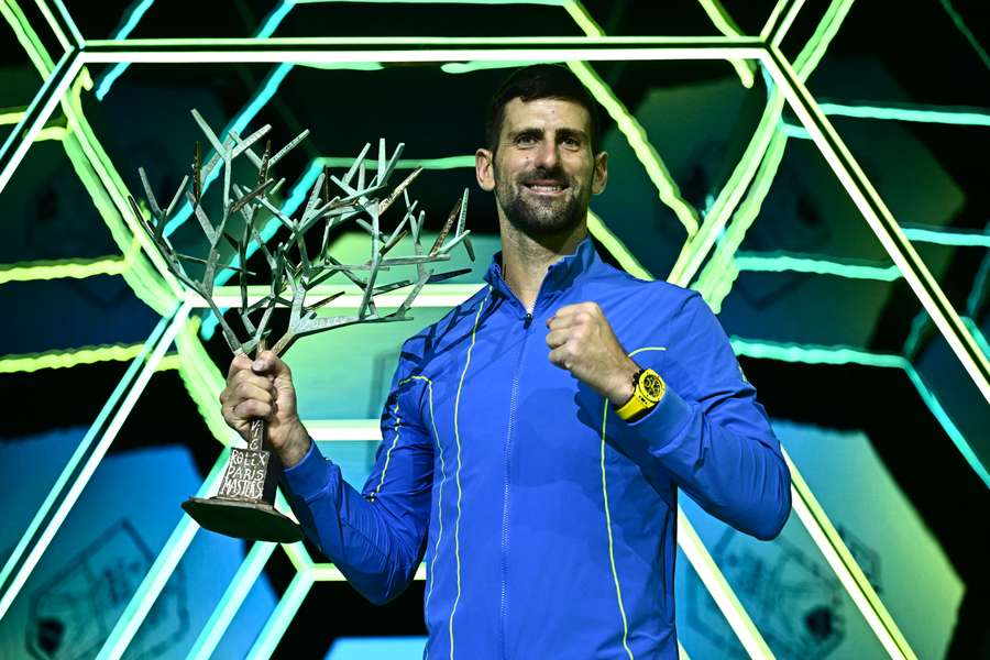 Novak Djokovic poses with Paris Masters trophy after beating Grigor Dimitrov in the 2023 final