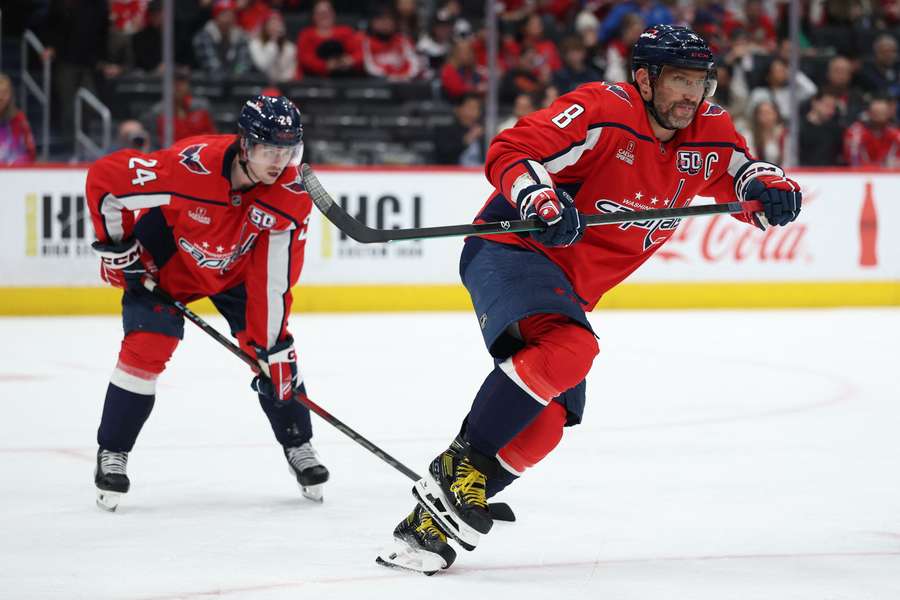 Capitals forward Connor McMichael (left) and Alexander Ovechkin (right) reacting to a face-off. (2025)