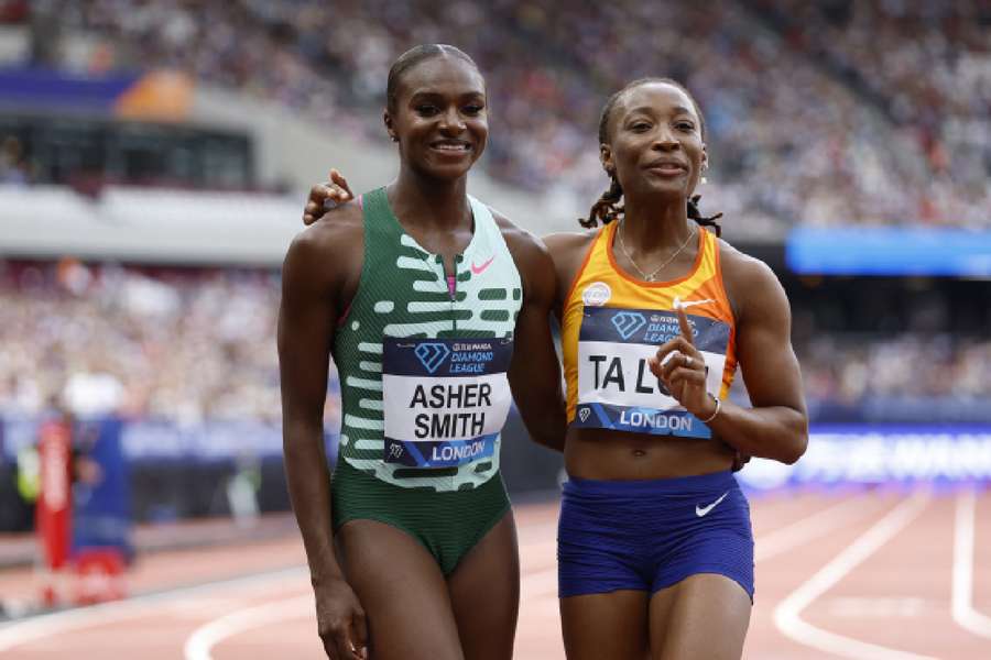 Marie-Josee Ta Lou celebrates winning the women's 100m final with second-placed Dina Asher-Smith