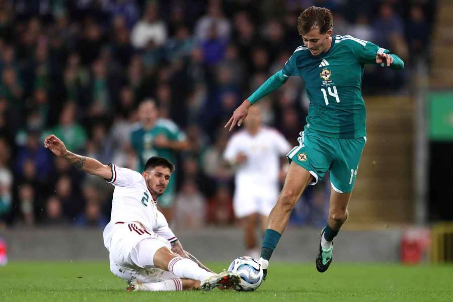 Hungary's Attila Osvath (left) and Northern Ireland's Isaac Price battle for the ball Hungary's Attila Osvath (left) and Northern Ireland's Isaac Price battle for the ball