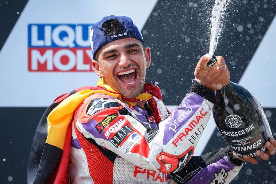 Jorge Martin celebrates on the podium after winning the MotoGP German Grand Prix