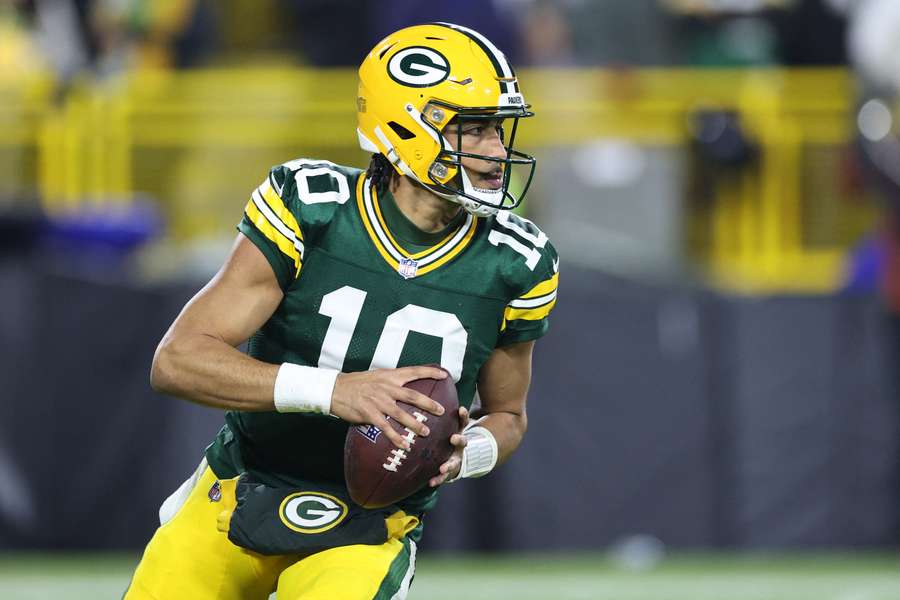Green Bay quarterback Jordan Love threw a touchdown pass to spark the Packers over New Orleans and clinch the hosts an NFL playoff berth