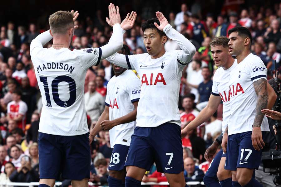 Tottenham Hotspur's South Korean striker #07 Son Heung-Min (C) celebrates with Tottenham Hotspur's English midfielder #10 James Maddison 