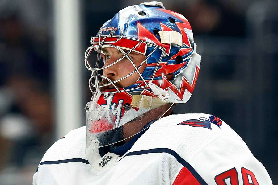 Capitals goalie Charlie Lindgren taking a break during a stoppage in play