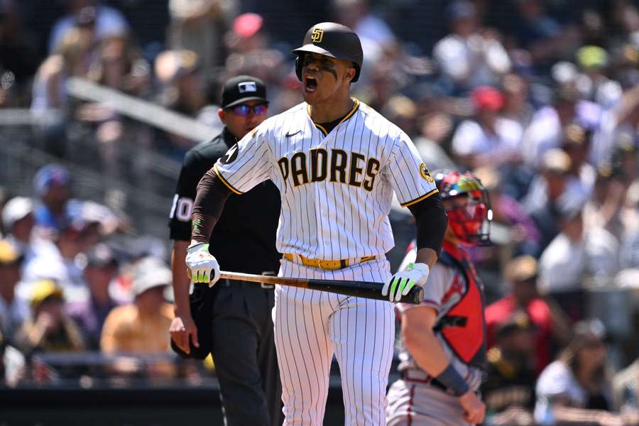 San Diego Padres left fielder Juan Soto reacts after hitting a home run