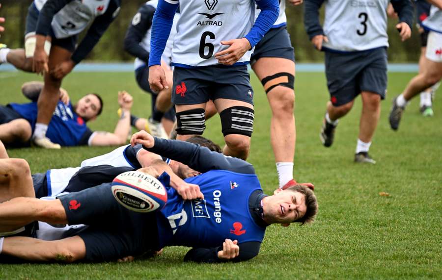 France's fly-half Matthieu Jalibert is injured during a training session in Marcoussis, France