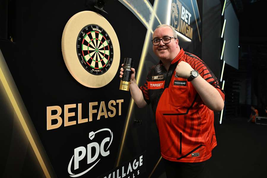 Stephen Bunting celebrates with the trophy