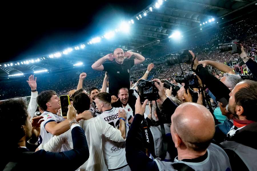 Vincenzo Italiano celebrates Bologna's first Coppa Italia trophy in half a century.