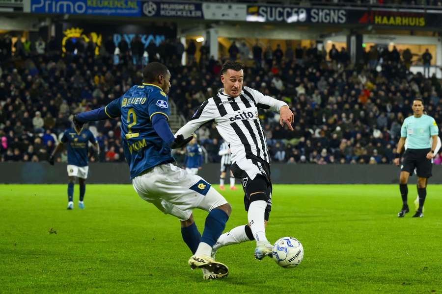 Mario Engels (R) of Heracles keeps the ball from Sparta's Said Bakari