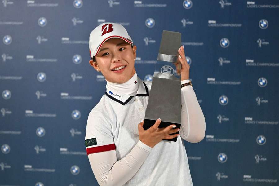 Yuri Yoshida poses with the trophy after her victory at the BMW Ladies Championship Yuri Yoshida poses with the trophy after her victory at the BMW Ladies Championship