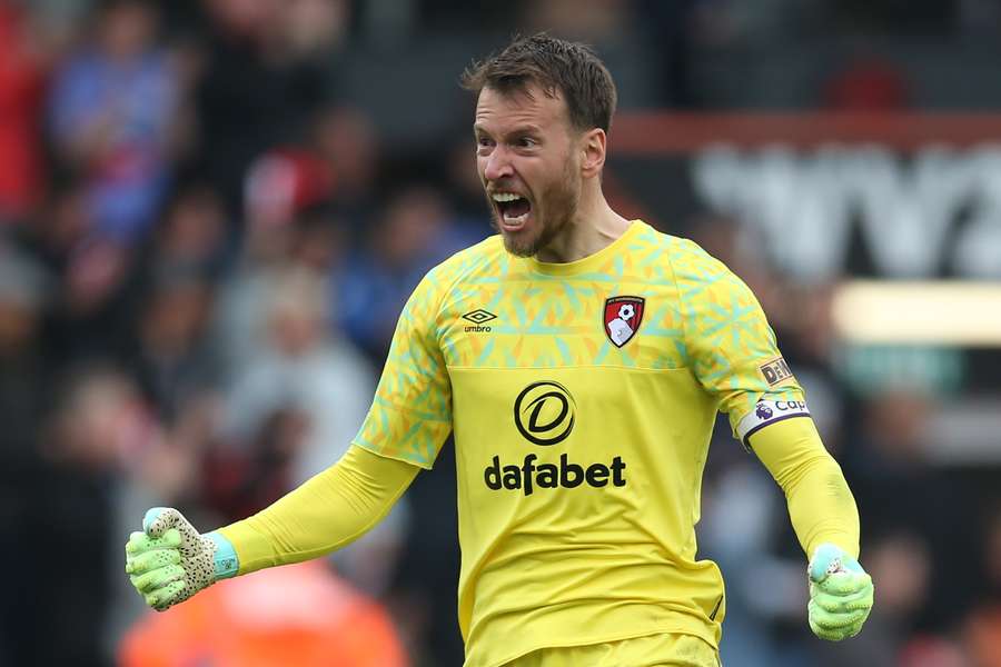 Bournemouth's Brazilian goalkeeper Neto celebrates after they score their fourth goal