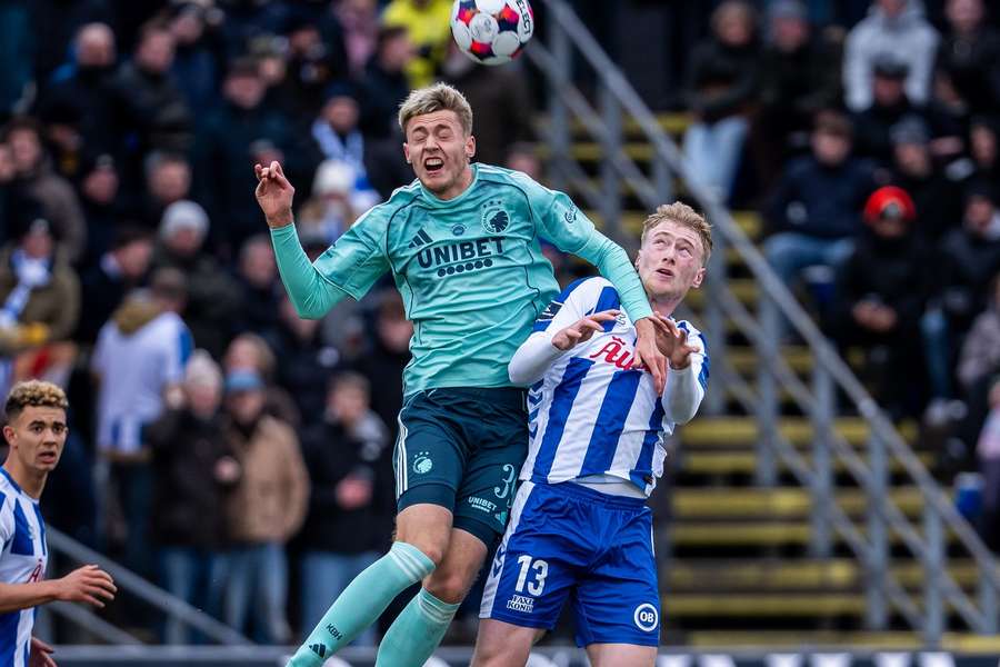 FC Copenhagen's Viktor Dadason (39) and OB's Julius Berthel Askou in an air duel