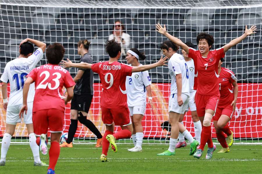 Myong Yu-Jong celebrates her opening goal for North Korea.