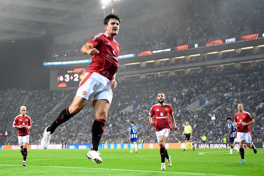 Harry Maguire celebrates scoring Man Utd's equalising goal in injury time