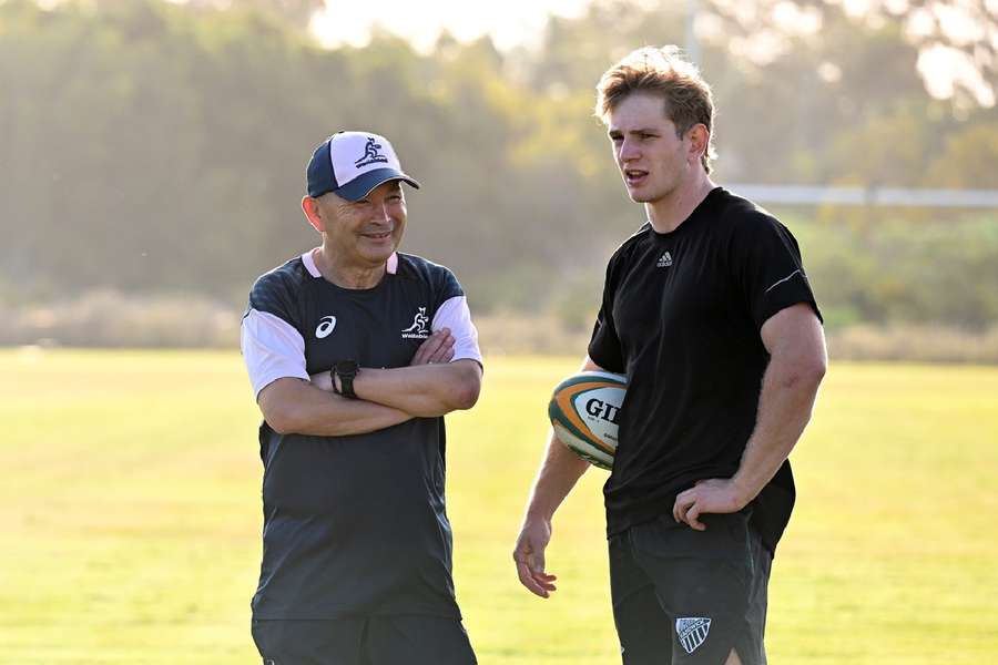 Max Jorgensen (R) talks with Wallabies head coach Eddie Jones