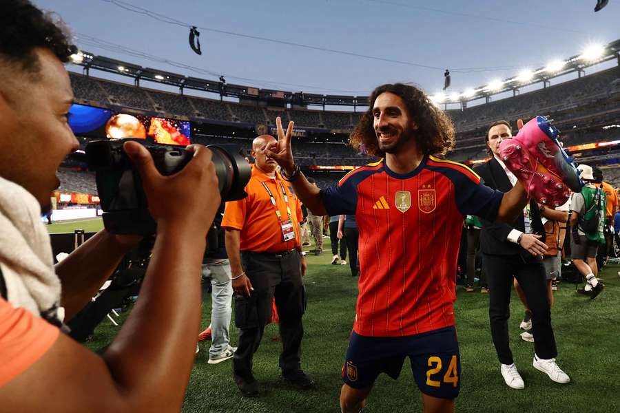 Marc Cucurella celebrates with his medal after winning the World Cup Marc Cucurella celebrates with his medal after winning the World Cup
