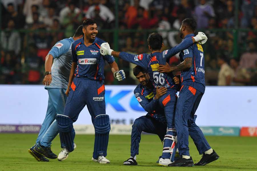 Lucknow Super Giants' players celebrate after beating Royal Challengers Bangalore by one run