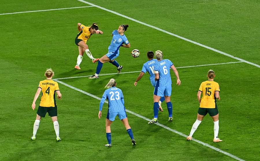 Hayley Raso shoots at goal as Lucy Bronze attempts to block the shot
