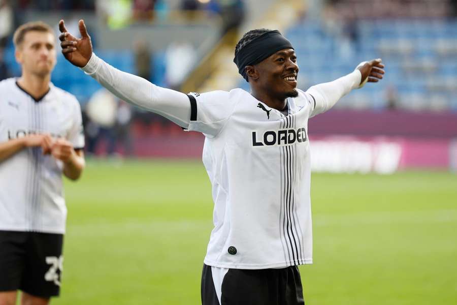 Mohammed Fuseini celebrates with Derby fans at full time. Mohammed Fuseini celebrates with Derby fans at full time.