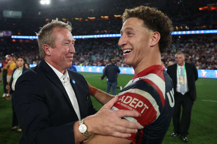 Roosters head coach Trent Robinson and Mark Nawaqanitawase embrace after the NRL Grand Final.