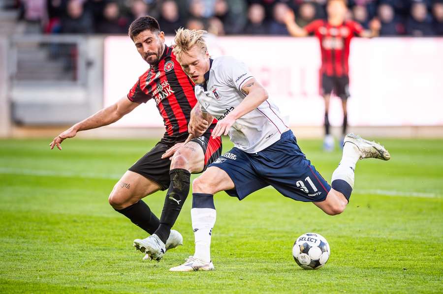 Tobias Bech battling for possession with FC Midtjylland's martin Erlic Tobias Bech battling for possession with FC Midtjylland's martin Erlic