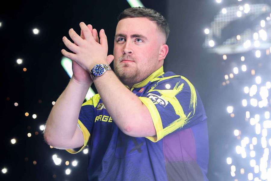 Luke Littler applauds the fans in Liverpool