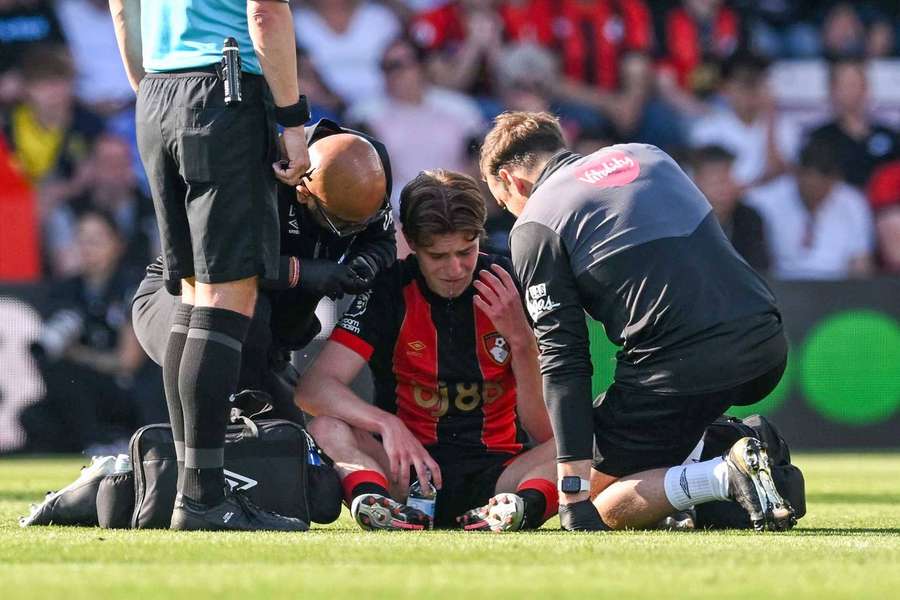 Alex Scott was treated by medics before he was substituted at half-time against Aston Villa