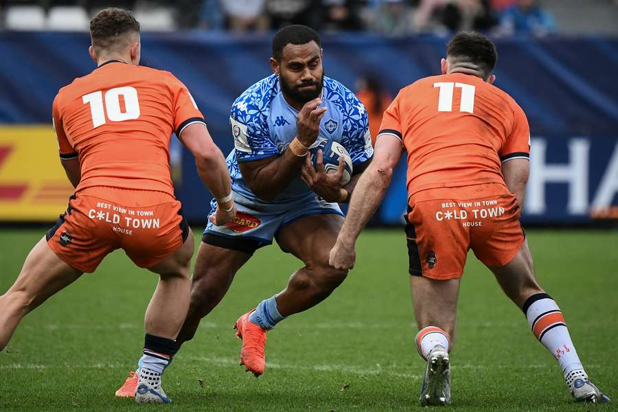 Castres' Fijian centre Adrea Cocagi runs with the ball during