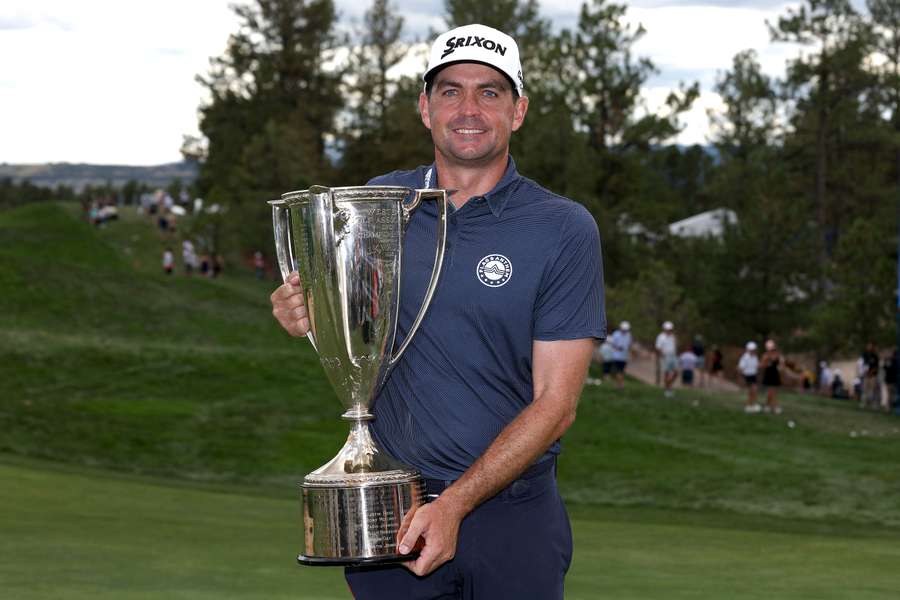 Keegan Bradley of the United States poses with the J.K. Wadley trophy after winning the BMW Championship