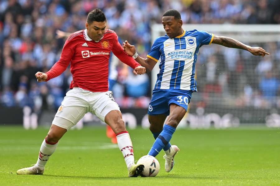 Casemiro vies with Brighton's Ecuadrorian defender Pervis Estupinan Casemiro vies with Brighton's Ecuadrorian defender Pervis Estupinan