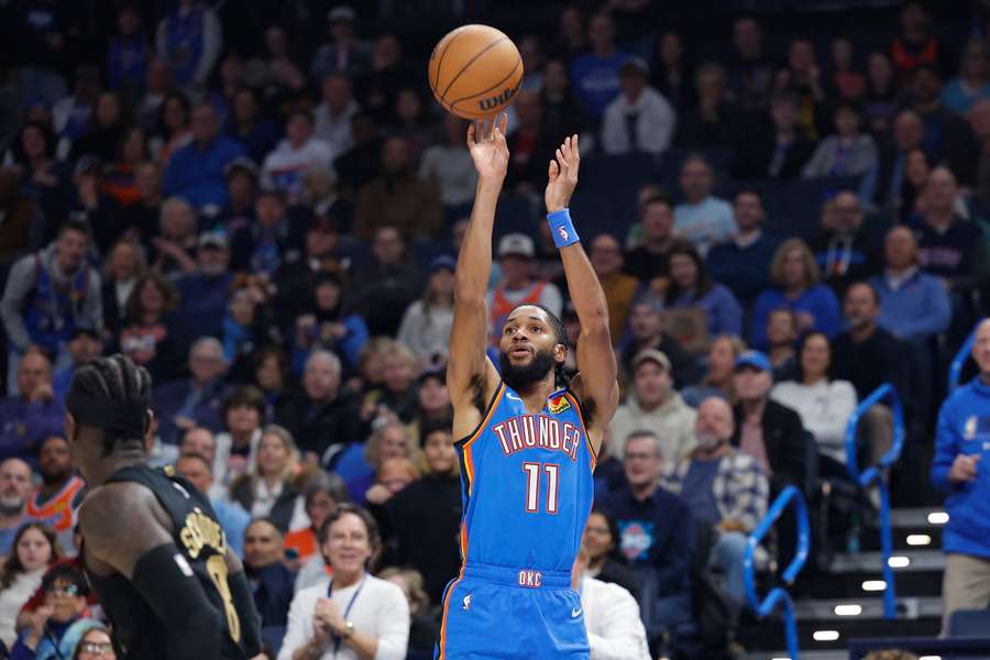 Oklahoma City Thunder guard Isaiah Joe shoots a three-point basket against the Cleveland Cavaliers