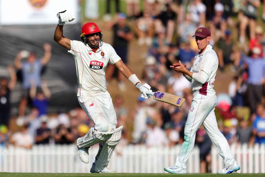 Jason Sangha celebrates hitting the winning runs during the Sheffield Shield final between South Australia and Queensland