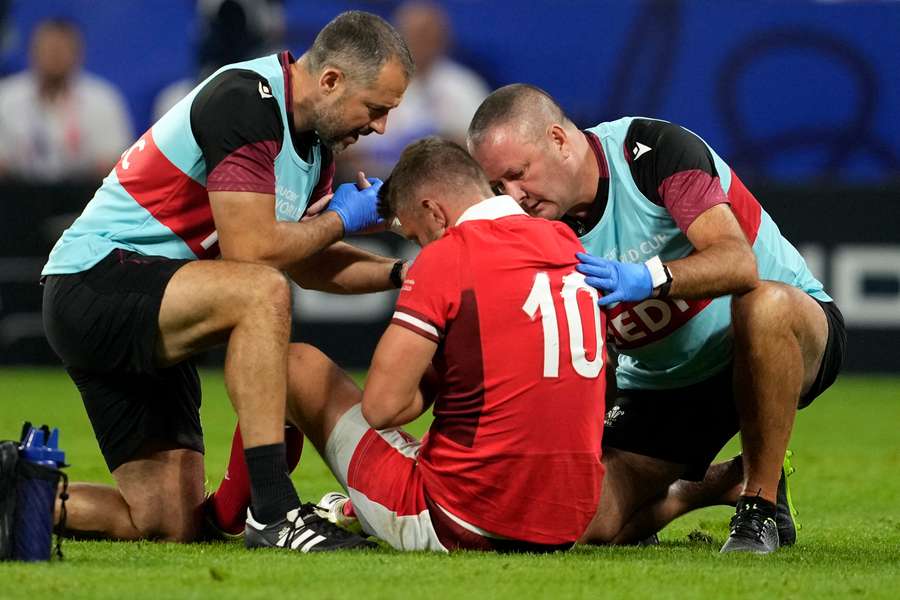 Biggar (C) receives treatment