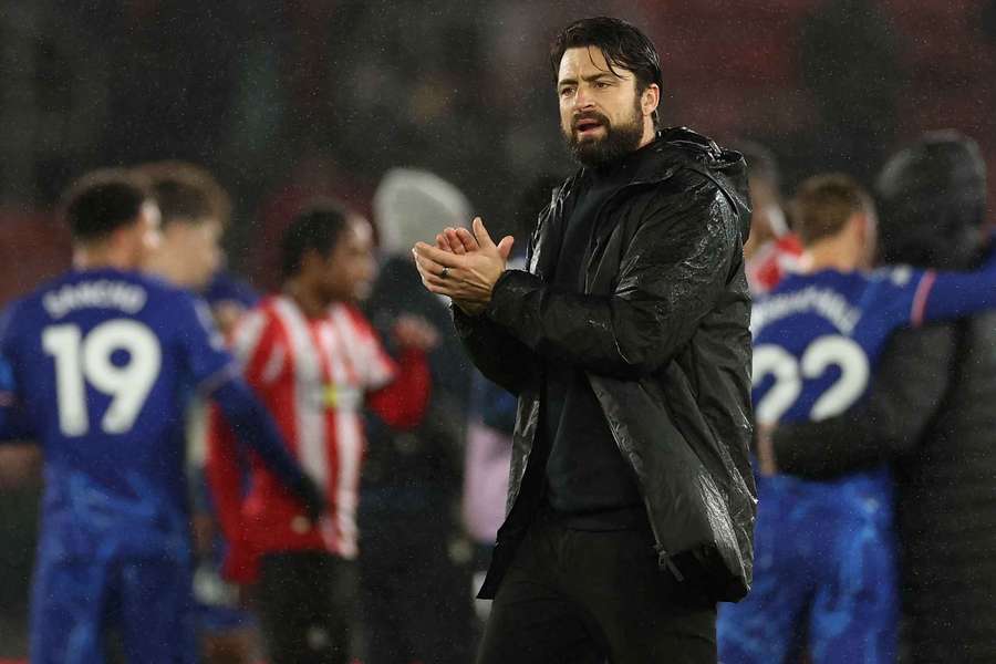 Russell Martin applauds fans after the match against Chelsea