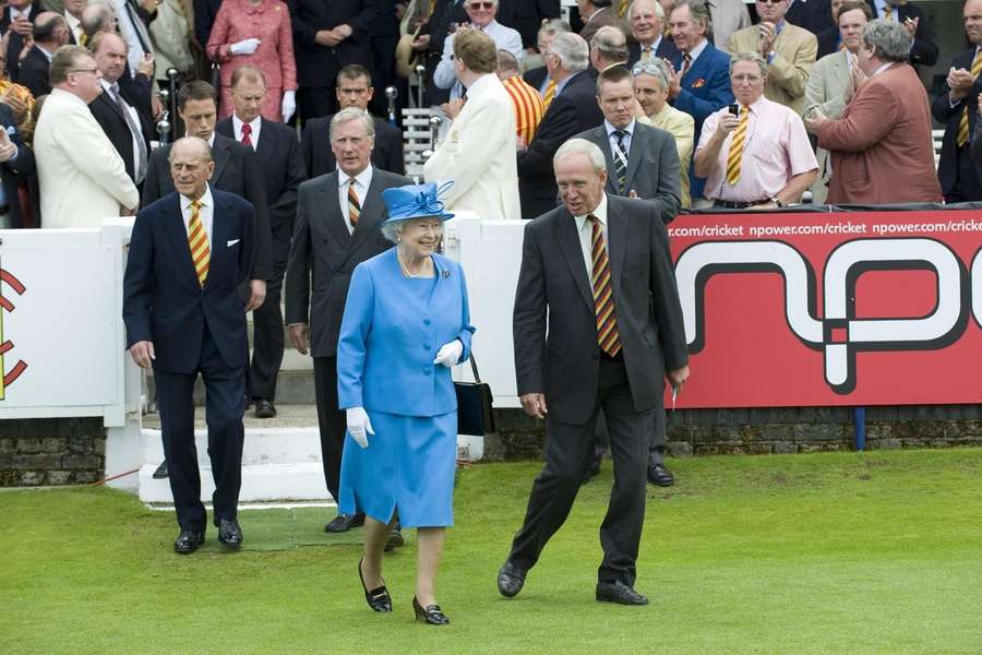 Queen Elizabeth II is led on to the field by MCC President Derek Underwood in 2009